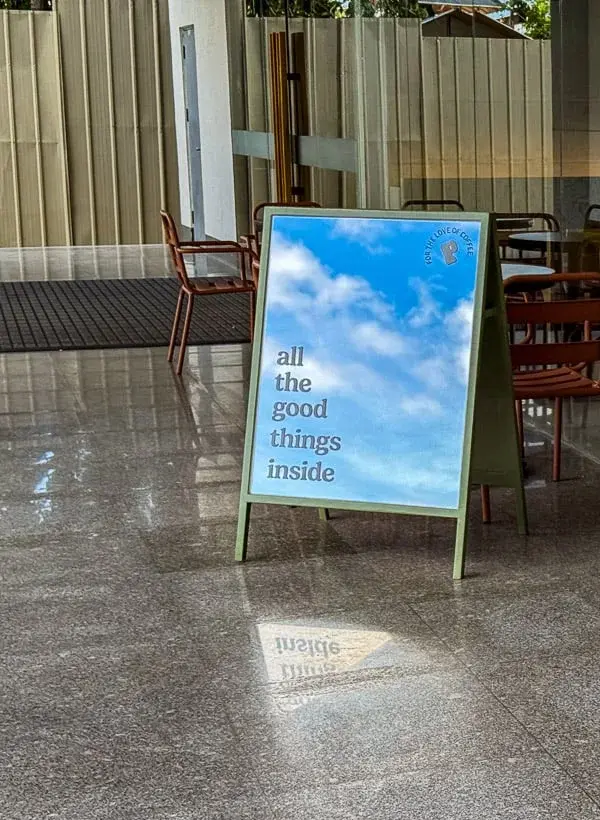 The “all the good things inside” sandwich board outside the Mabuhay Tower café